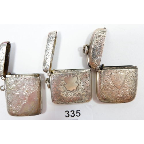335 - Three silver engraved vesta cases, Birmingham 1898, 1906 and 1910