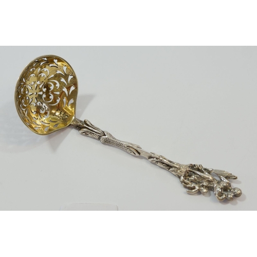 344 - A silver sifter spoon with mother and child terminal and gilt bowl, 51g