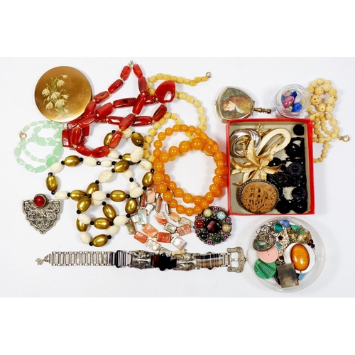 521 - A box of various costume jewellery including a Miracle Celtic style stone set brooch etc.