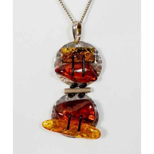 531 - A large silver and amber pendant and a pair of silver and amber earrings