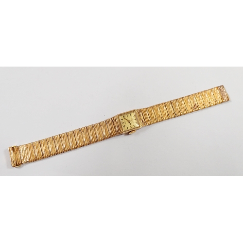 534 - A Rotary vintage 9 carat gold ladies wrist watch and textured strap, 39g