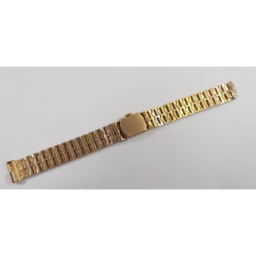 534 - A Rotary vintage 9 carat gold ladies wrist watch and textured strap, 39g