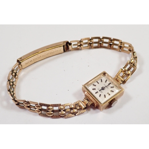 538 - A Perfex Art Deco 9 carat gold square faced ladies wrist watch on rolled gold strap