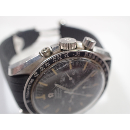 545 - An Omega Speedmaster professional wrist watch with three secondary dials and yellow batons (the type... 