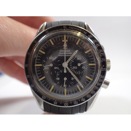 545 - An Omega Speedmaster professional wrist watch with three secondary dials and yellow batons (the type... 