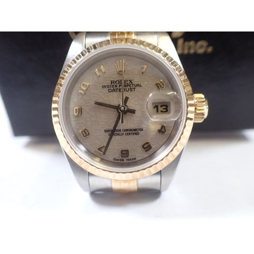 551 - A Rolex ladies Oyster Datejust gold and stainless steel wrist watch 