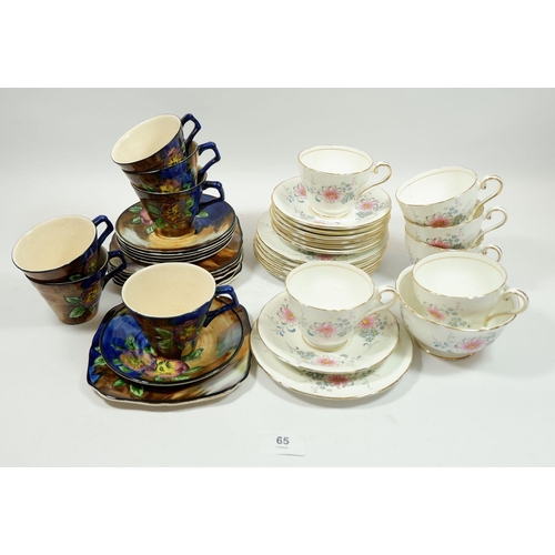 65 - A set of six Aynsley 'Charmagene' trios with sugar bowl together with a set of six H & K Tunstall tr... 