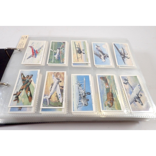 681 - An album of 25 sets of cigarette cards including Players Aircraft, Wild Animal Heads etc. cat value ... 