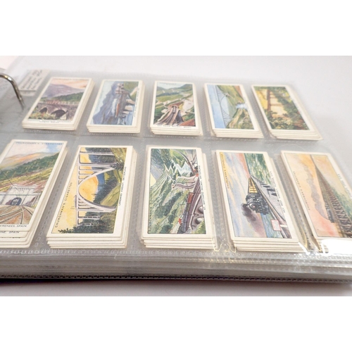 681 - An album of 25 sets of cigarette cards including Players Aircraft, Wild Animal Heads etc. cat value ... 