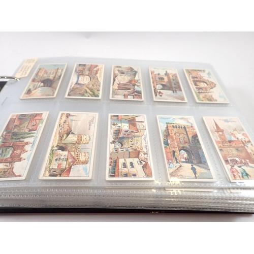 682 - An album of twenty two sets of cigarette cards including Players Celebrated Gateways, cat value £500