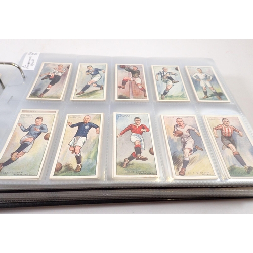 684 - An album of football themed cigarette cards, sets and odds, cat value £1000