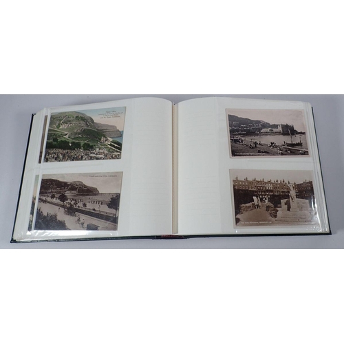 695 - An album of postcards, mixed subjects but mainly topographical, with some early cards, (200)