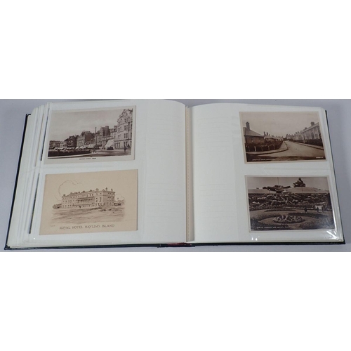 695 - An album of postcards, mixed subjects but mainly topographical, with some early cards, (200)