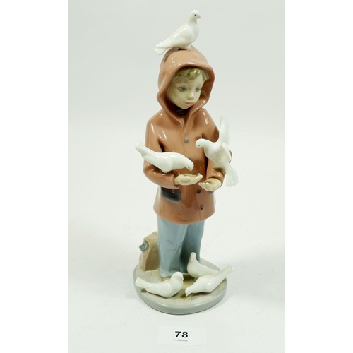 78 - A Lladro figure boy with doves, 24cm