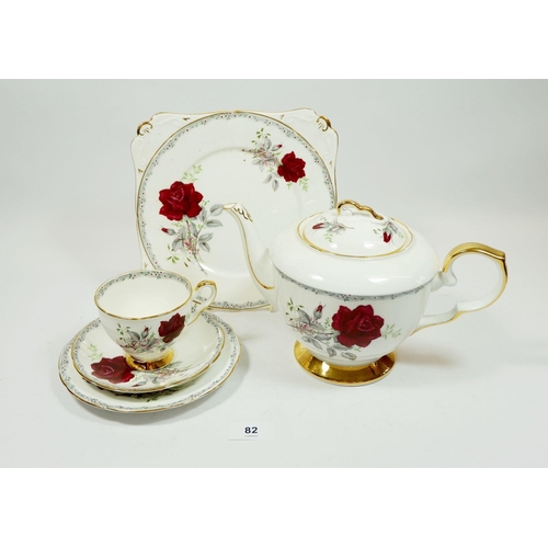 82 - A Royal Stafford 'Roses to Remember' teaset comprising twelve trios, teapot, milk jug, sugar bowl an... 