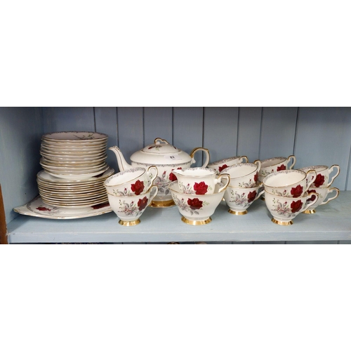 82 - A Royal Stafford 'Roses to Remember' teaset comprising twelve trios, teapot, milk jug, sugar bowl an... 