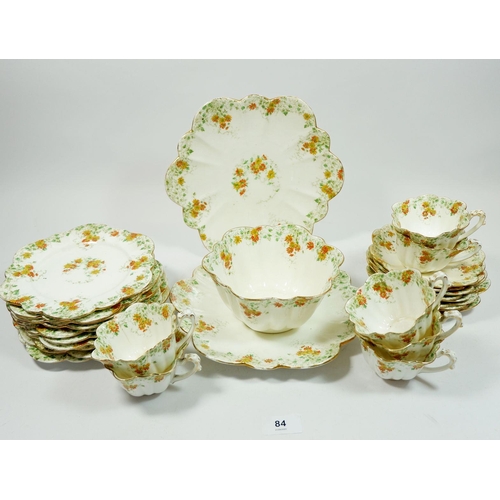 84 - A Victorian Foley floral tea service No 6948, comprising: seven cups, nine saucers, ten side plates,... 