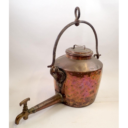 884 - A 19th century copper hot water urn with cast iron handle