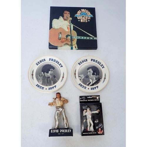 1049 - A collection of Elvis Presley memorabilia including Elvis Presley Greatest Hits vinyl's, six volumes... 