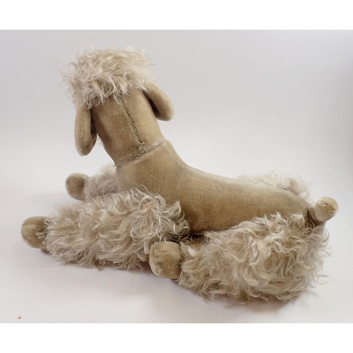 1054 - A Steiff large poodle, 40cm tall