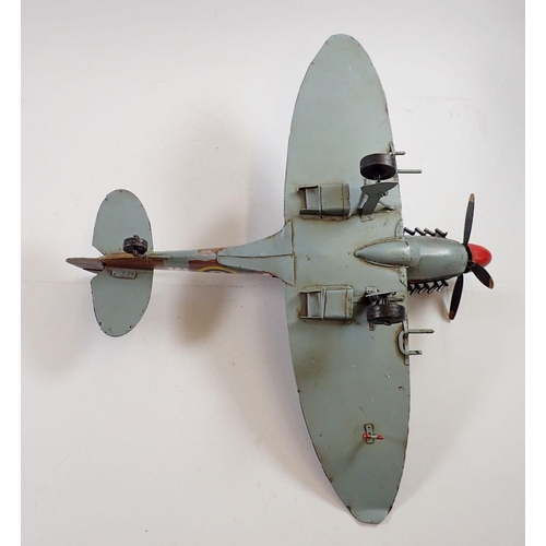 1063 - A large painted metal model Spitfire, 40cm long