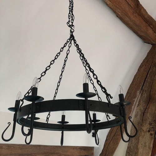 1074 - A blacksmith made large wrought iron 'Shepherd's Crook' eight light chandelier, designed and made by... 