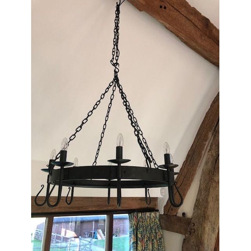 1074 - A blacksmith made large wrought iron 'Shepherd's Crook' eight light chandelier, designed and made by... 