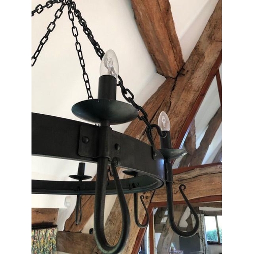 1074 - A blacksmith made large wrought iron 'Shepherd's Crook' eight light chandelier, designed and made by... 