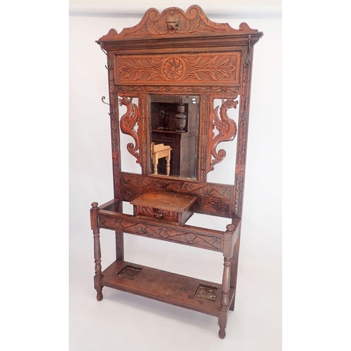 1085 - A Victorian carved oak hallstand with dragon and foliage decoration, 103 x 31cm x 210cm