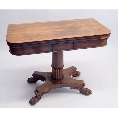 1086 - A 19th century rosewood fold top card table on half gadrooned column and quadruple paw feet, 90cm wi... 