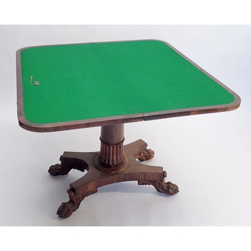 1086 - A 19th century rosewood fold top card table on half gadrooned column and quadruple paw feet, 90cm wi... 