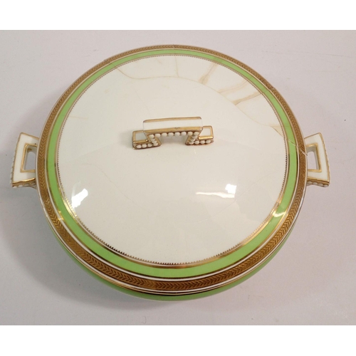 109 - A Cauldon China dinner service with green and gilt borders comprising: twelve dinner plates, twelve ... 