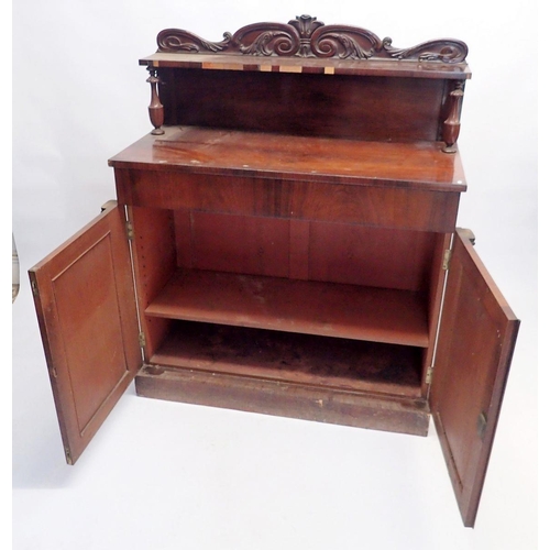 1092 - An early Victorian mahogany chiffonier with carved raised back over frieze drawer and pair of panell... 