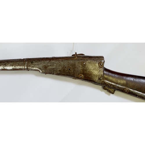 1097 - A 19th century Turkish musket with gilt metal studded decoration and engraving, 157cm long