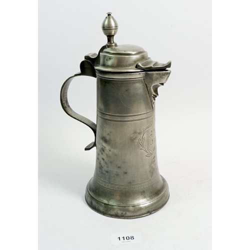 1108 - A 19th century pewter lidded flagon dated 1829, 28cm tall