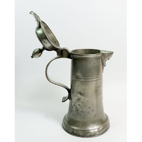 1108 - A 19th century pewter lidded flagon dated 1829, 28cm tall