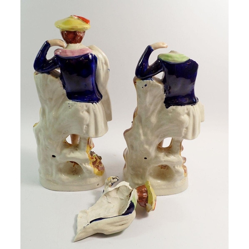 111 - A pair of large Staffordshire highland figures, one badly damaged, 37cm tall