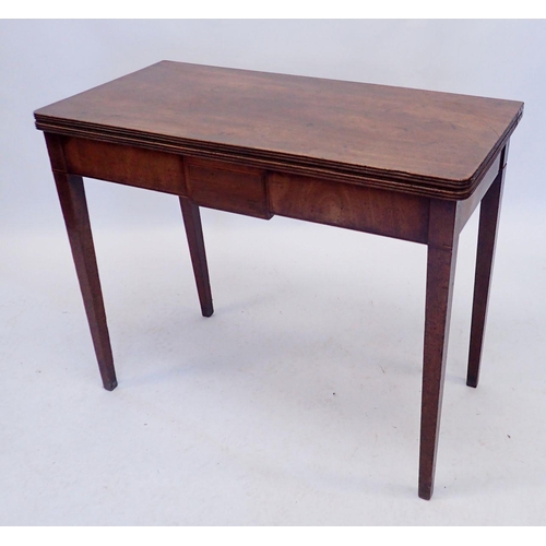 1123 - A Georgian mahogany fold top tea table on square supports, 91 x 45cm