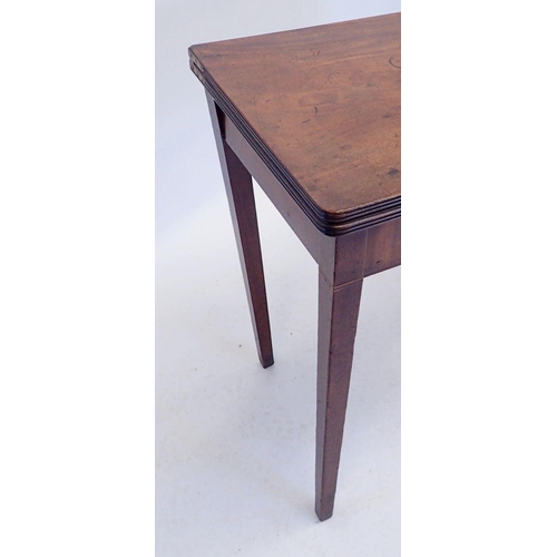 1123 - A Georgian mahogany fold top tea table on square supports, 91 x 45cm