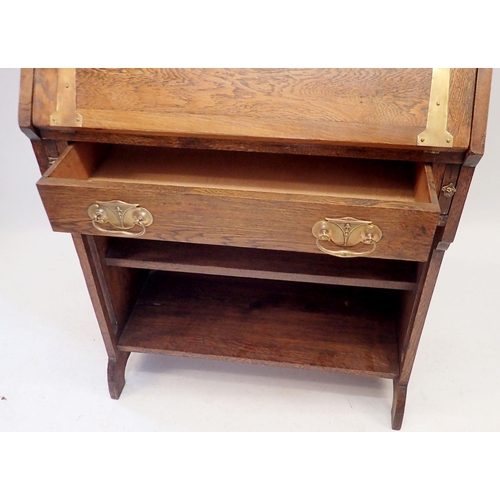 1128 - An oak Liberty Style Arts & Crafts small bureau with lead glazed doors inset vaseline glass flowers,... 