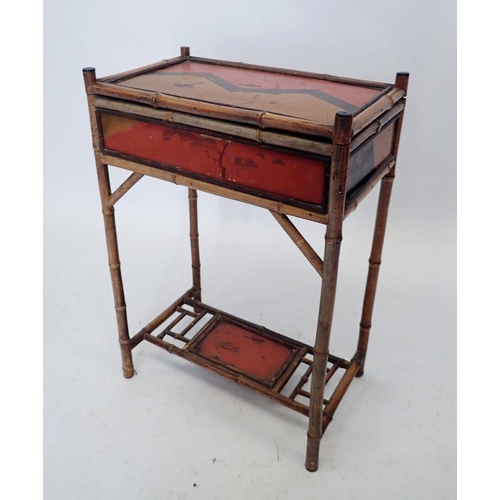 1130 - An early 20th century lacquer and bamboo rise top sewing table, 45 x 27 x 66cm