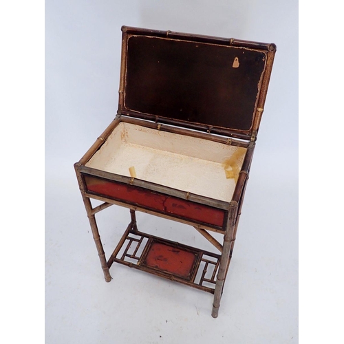 1130 - An early 20th century lacquer and bamboo rise top sewing table, 45 x 27 x 66cm