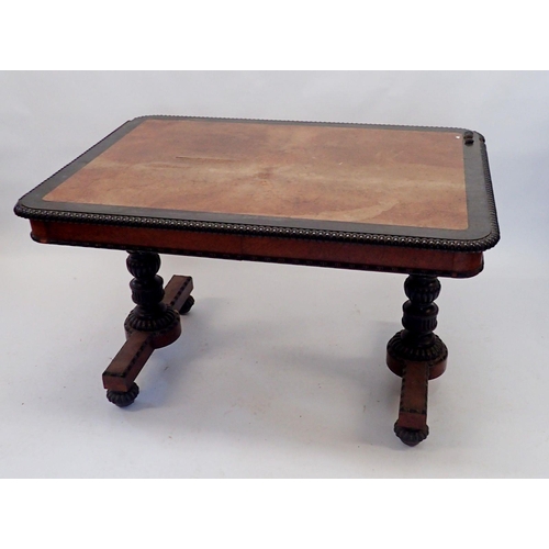 1134 - An early Victorian walnut and ebony library or centre table with gadrooned border, turned column end... 