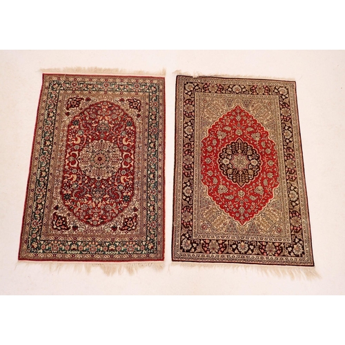 1136 - Two Persian small rugs with medallion designs, 92 x 62cm