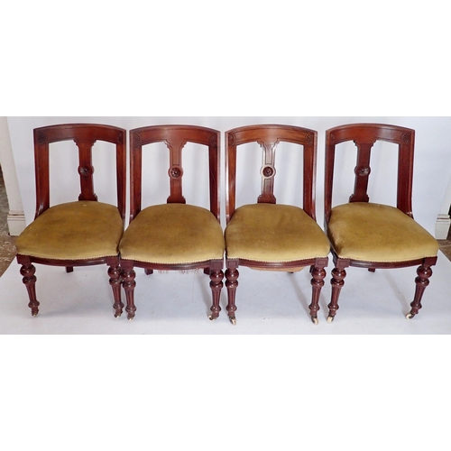 1145 - A set of four Victorian mahogany Etruscan style slope back dining chairs with incised decoration