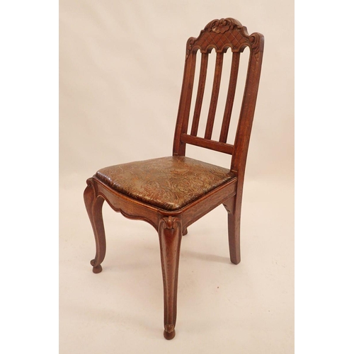 1146 - A set of eight French slat back dining chairs with trellis and scrollwork carved top rail