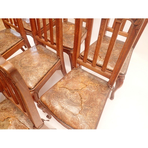 1146 - A set of eight French slat back dining chairs with trellis and scrollwork carved top rail