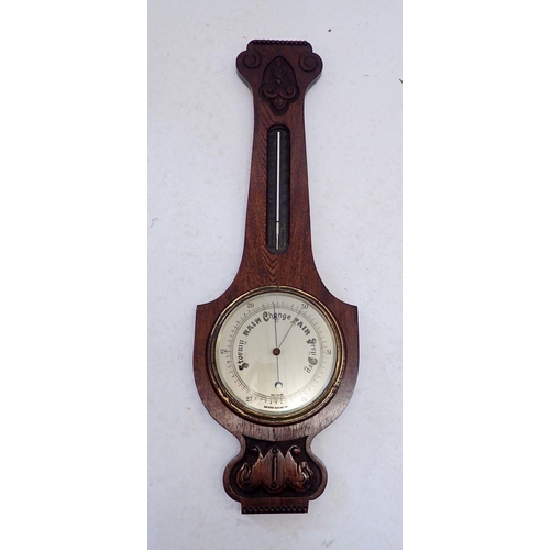 1149 - An oak cased aneroid barometer/thermometer