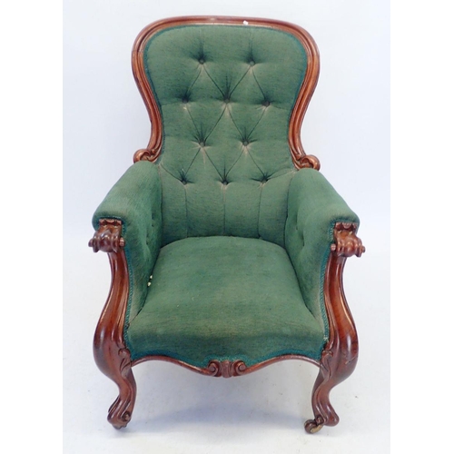 1150 - A Victorian green button upholstered armchair with mahogany frame, carved scroll arms and supports