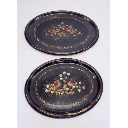 1152 - Two Victorian oval papier Mache trays inlaid with mother of pearl and painted flowers within gilt bo... 